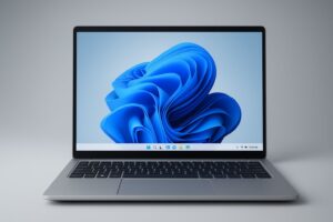 New laptop running Windows 11 next to old Windows 10 computer