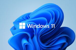 Windows 11 desktop interface with taskbar and widgets